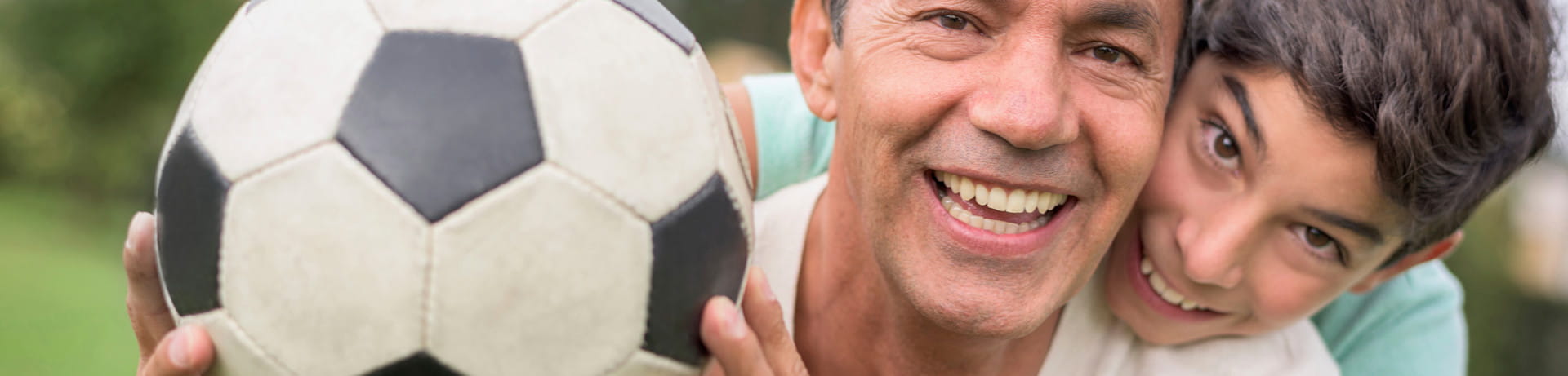 fatherandsonplayingsoccerd