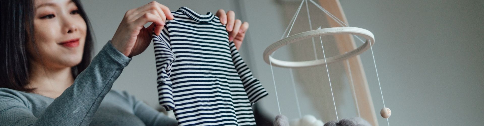 Mom-to-be preparing nursery for baby